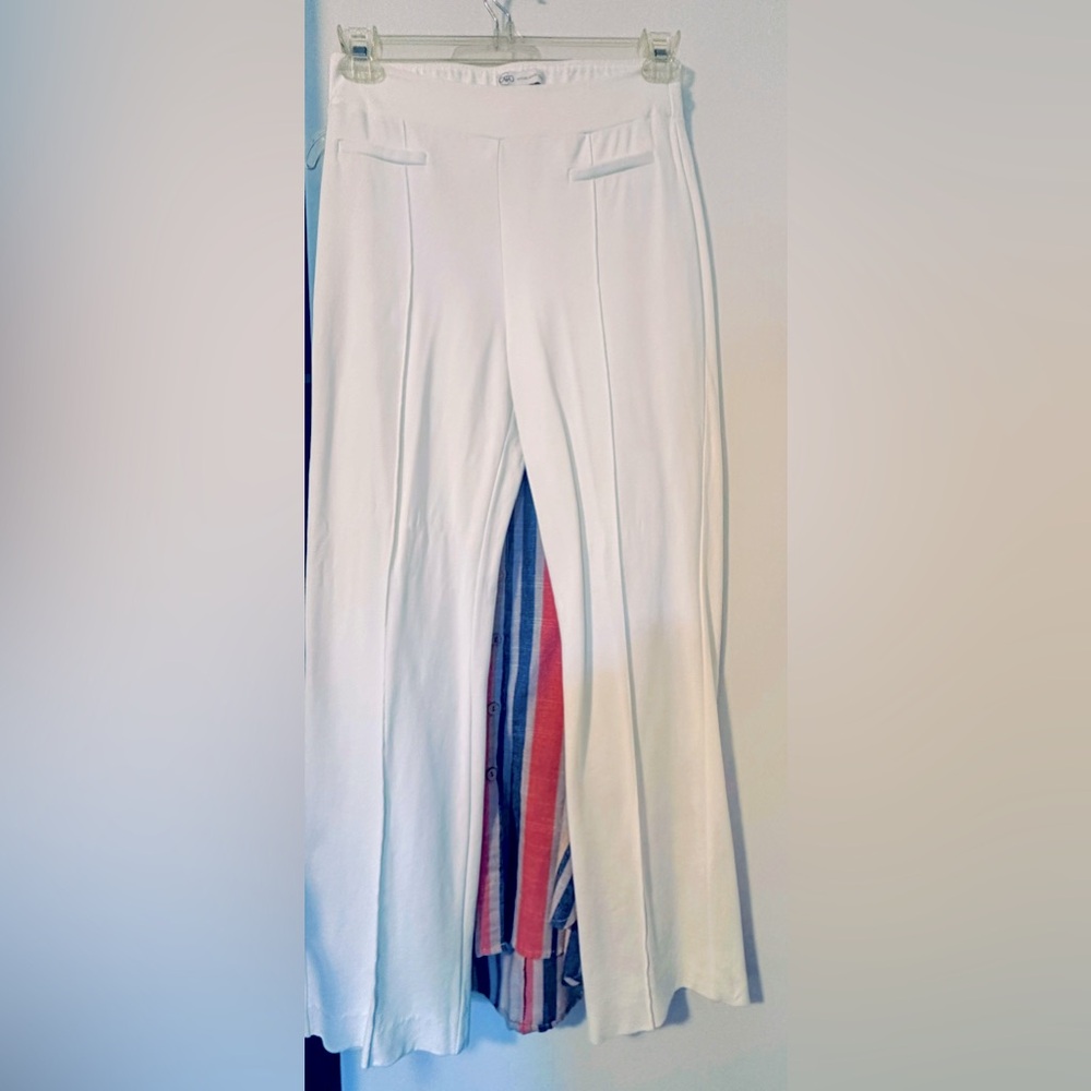 Stretchable trousers in cream/ bone